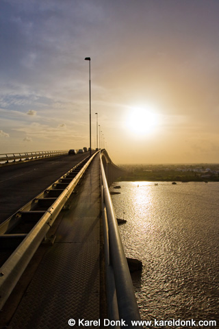 Karel Donk on the J.A. Wijdenbosch bridge at sunset