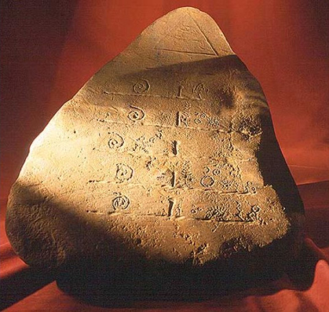 Stone artifact with a pyramid containing the "All Seeing Eye"
