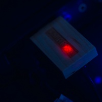 Custom USB Flash Drive — A red light inside the drive turns on when connected to the computer.